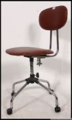 A retro style chrome and vinyl upholstered office swivel chair.