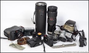 Cameras; A Tamron 80, 250mm Minolta SRT 101 lens,