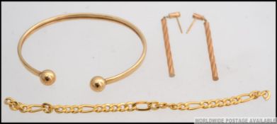 A 9ct cuff bracelet along with a matching pair of drop earrings and 13cm length of 9ct gold chain.