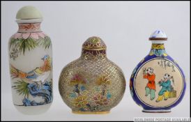 A collection of 3x oriental Chinese snuff bottles - one painted with traditional scenes,