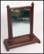 A large Victorian mahogany swivel dressing mirror on carved scroll supports H86cm W71cm together