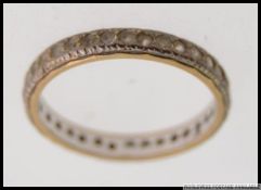 A vintage ladies 9ct gold and diamond ? stone set full eternity ring. Total weight 2.