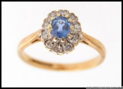 A vintage 9ct gold diamond and aquamarine ladies cluster ring.