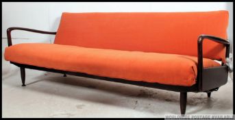 A stunning retro original 1960's teak wood day bed sofa.