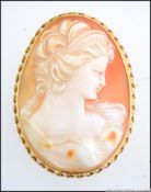 A stunning 18ct gold ladies shell cameo brooch with classical maiden study.