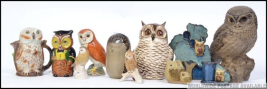 A collection of ceramic Owls to include examples Beswick, Poole,