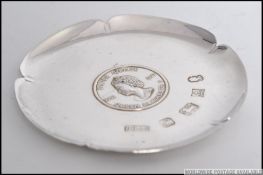A silver hallmarked Tudor Rose style pin dish ( with original box ) to commemorate the Silver