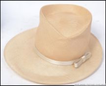 Philip Treacy couture hat constructed of fine straw with ribbon in with the original box.
