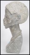 An African believed Zimbabwe carved stone bust of a Shona woman with beaded necklace.