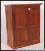 An early 20th century hanging mahogany drinks / medicine cabinet.