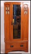 An Edwardian satin walnut single wardrobe.