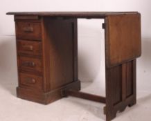 A 1940's Air Ministry style clerks oak desk with open kneehole recess and single pedestal of three