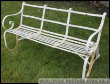 A good early 20th century cast iron painted strapwork garden bench.