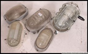 A collection of vintage industrial bulk head lights to include Goutherie, Dorman,