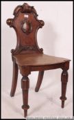 A Victorian mahogany hall chair.