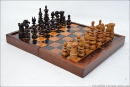 An early 19th century boxwood and ebony Calvert of London, 189 Fleet Street chess set.