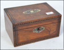 A 19th century walnut Tunbridge banded work box, having mother of pearl escutcheon,