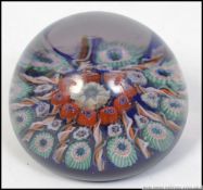 A 20th century decorative glass milliefioiri paperwork having decorative caneworked centre (