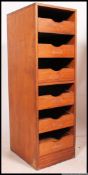 A 1970's retro school / industrial upright teak wood filing cabinet.