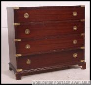 A 20th century mahogany and brass bound campaign chest of drawers.
