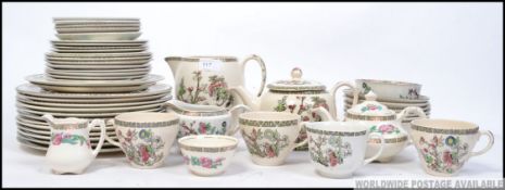 An Indian tree pattern dinner and tea service. Comprising cups, saucers, plates, teapot etc.