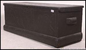 A Victorian mahogany blanket box being raised on a plinth base with hinged top above.