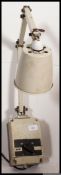 An early 20th century industrial factory wall mounted adjustable Memlite anglepoise light,