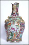 A 19th century Chinese Canton famille rose flange shouldered vase.