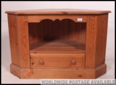 A good quality country pine corner unit / tv stand with open recess and single drawer.