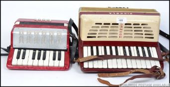 A vintage mid century Hohner Piccola accordion in a working order along with a childs accordion