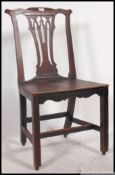 A 19th century North country oak panel seated dining chair.