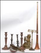 Metalwares: a collection of metalwares to include a Mr Punch doorstop, pusher candlesticks,