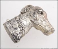 A Victorian style silver plated vesta case in the shape of a dogs head, with hinged lid.
