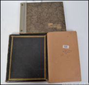 A black and white photograph album consisting of many images of aeroplanes and sailing yachts from