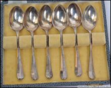 A cased set of 6 silver hallmarked spoons complete in the presentation box.