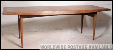 A retro 1970's good Danish style teak wood coffee table of rectangular form raised on shaped legs