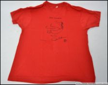 John Lennon - A John Lennon of The Beatles ' Bag One ' T-Shirt and badge purchased by the vendor in