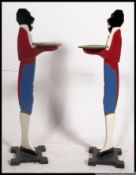 A pair of negro dumbwaiters of handpainted wooden form.