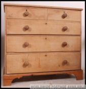 A Victorian pine 2 over 3 country chest of drawers being raised on plinth base with 2 short and 3
