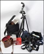 A Chinon CES Slr camera together with a Pentax 28-55mm lens,