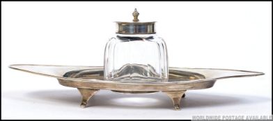 An Edwardian silver hallmarked conserve pot and matching tray of lozenge form.