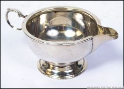 An early 20th century silver hallmarked creamer with Birmingham assay marks dated 1932 by Marson