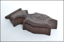 A black forest carved wood pocket watch case.