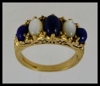A vintage ladies 9ct gold moonstone and sapphire set dress ring, the stones of cabochon cut.