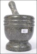 A large vintage 20th century pestle and mortar.