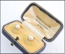 A pair of vintage 9ct gold pearl stud gentlemans shirt buttons complete in the original
