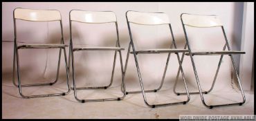 A set of 4 1970's retro chrome and plastic dining chairs.