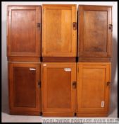 A bank of six mid 20th century Air Ministry military industrial bedside wooden lockers,