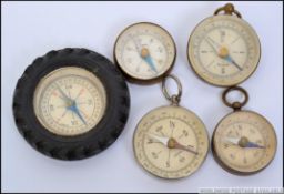 A group of 5 20th Century compasses of small form to include possibly scouting examples