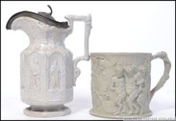 A Victorian parian Charles M Rice 1847 ware jug cast in relief with shaped top together with a